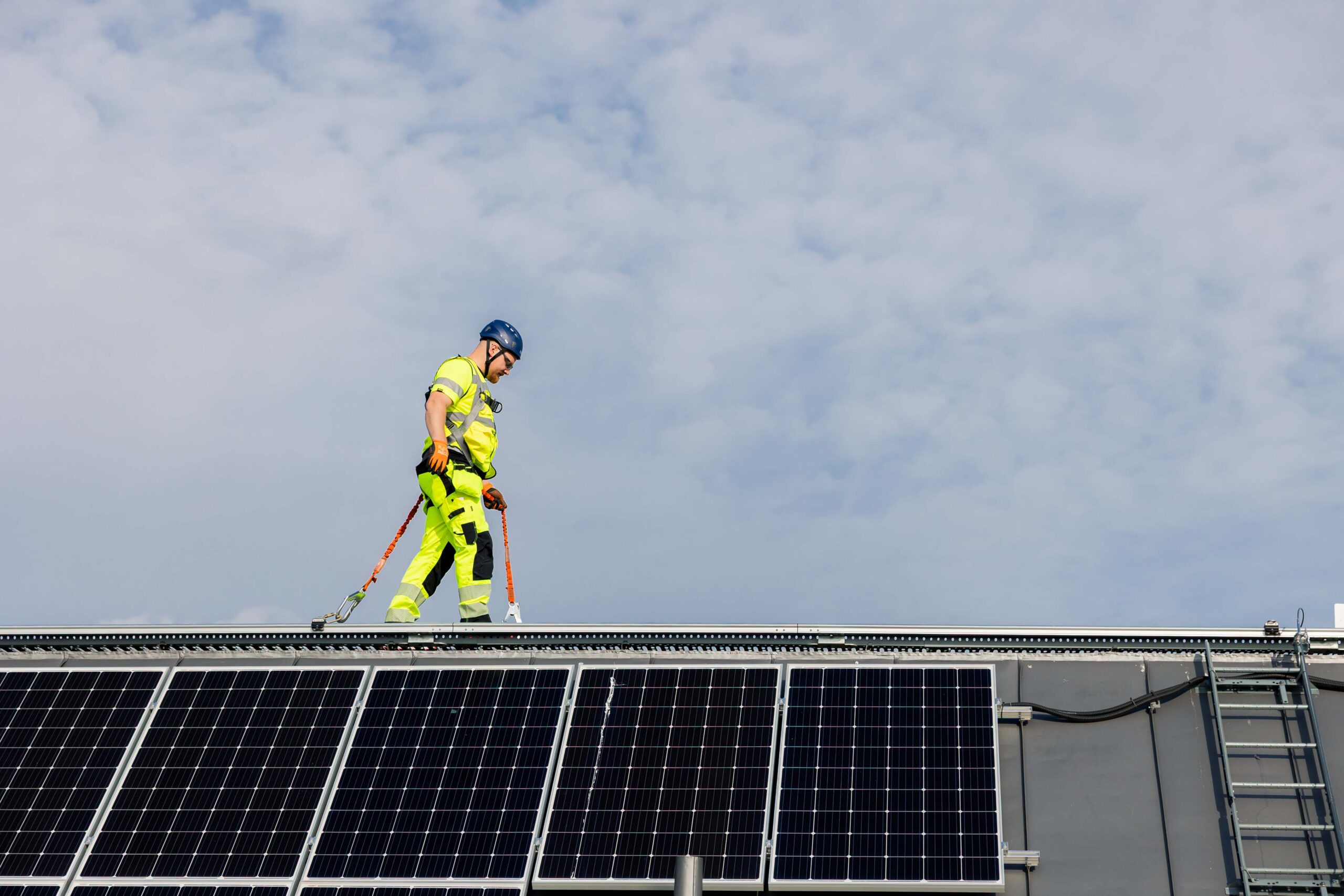 Man walking on SecuRail Pro-Standing Seam-High Angle Sloped Roof